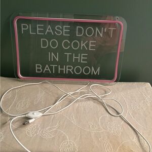 Pink and White Bathroom Sign